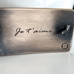 custom bronze belt buckle with je t'aime engraved on back