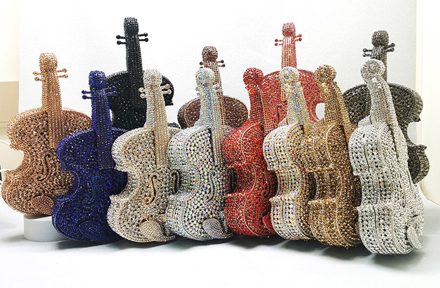 many violin crystal purses in different colors