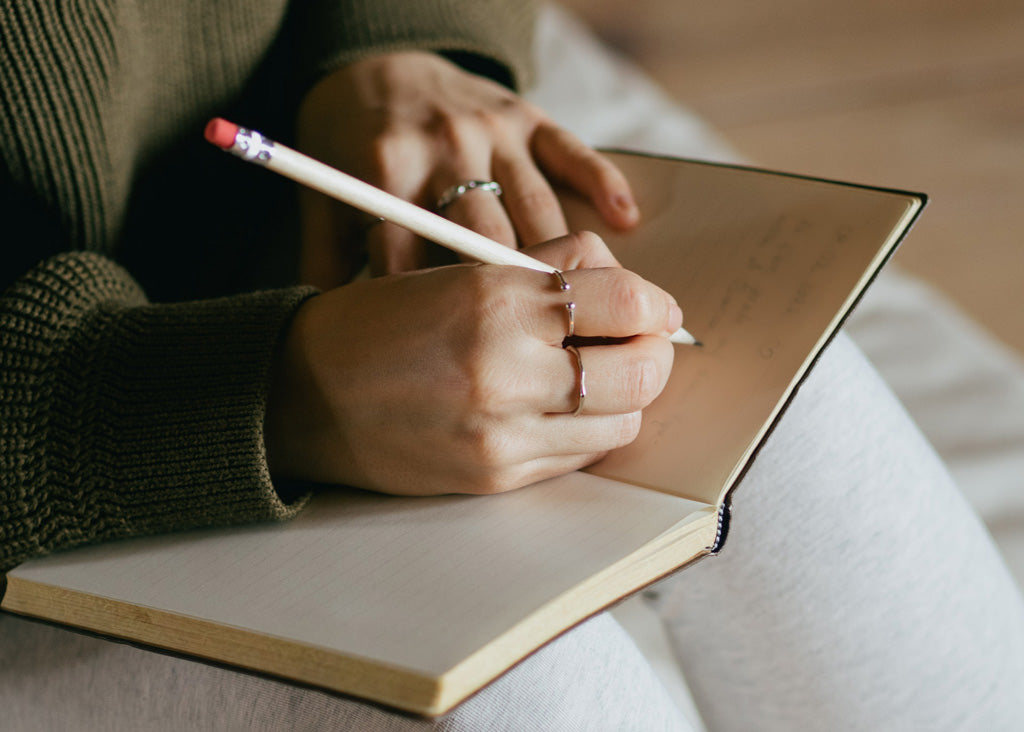 Journaling: Woman writes in a notebook