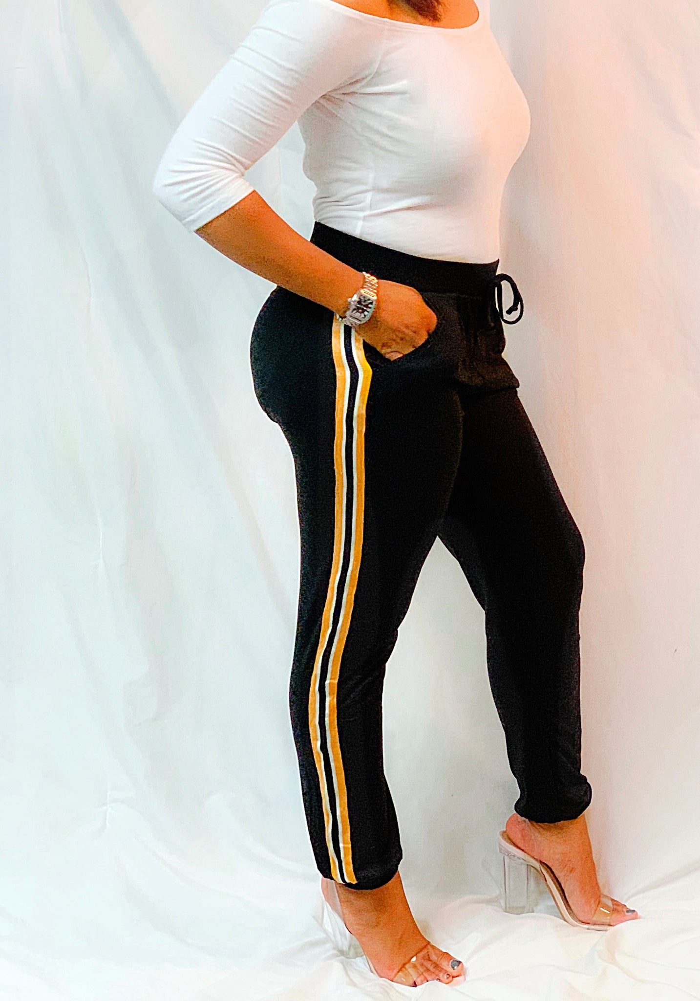 black joggers with yellow stripe