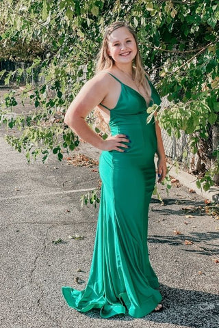 a girl outside in a fitted prom dress for prom pictures