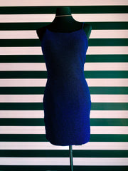 Navy sparkle, sheath short dress. It is on a black mannequin, in front of XO's striped wall.
