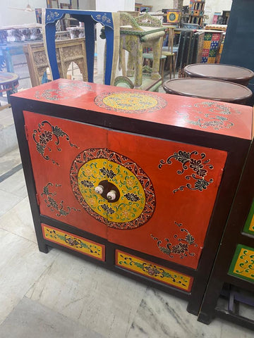  A cabinet hand painted in red, a colour traditionally associated with love and passion.
