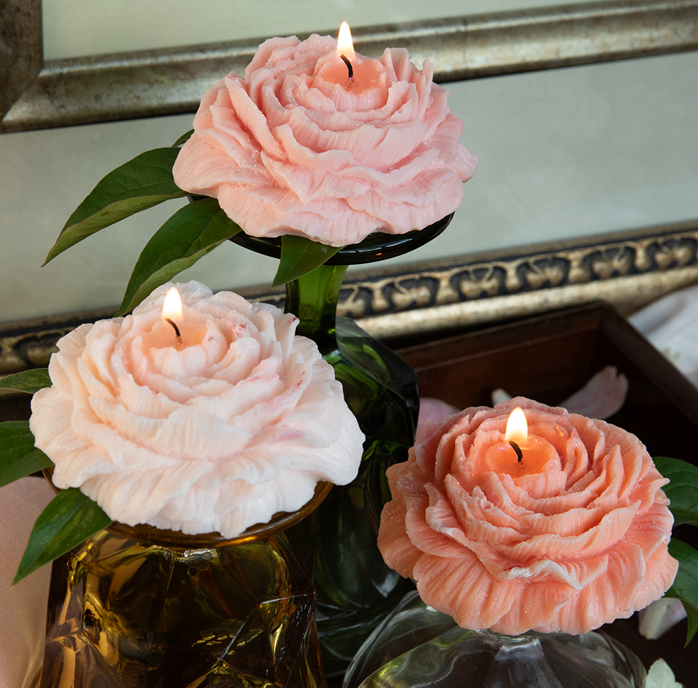 Set of three peony shaped and scented candles.