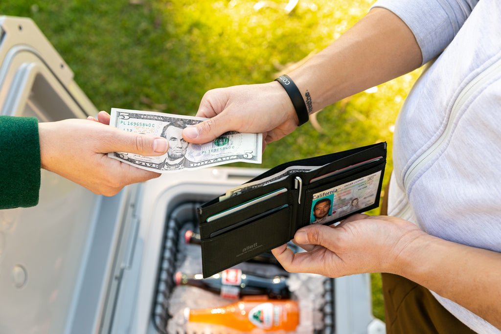 Allett Wallet Opened and Man Handling Cash 