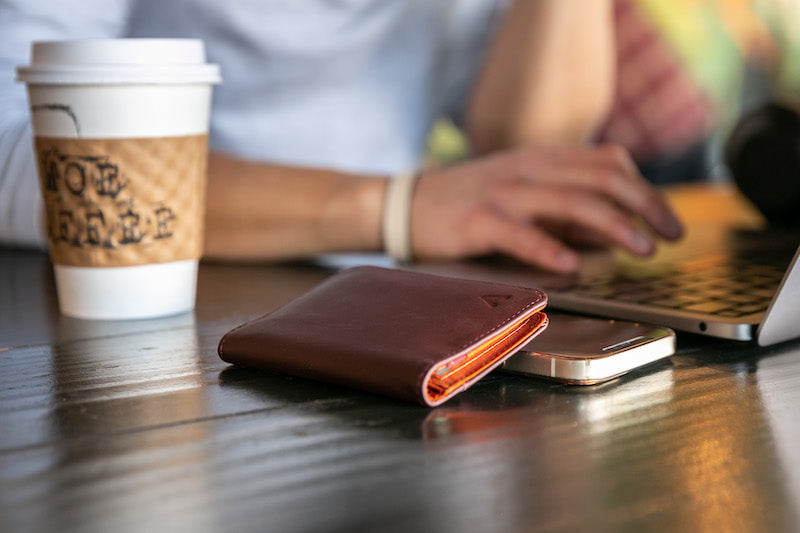 Coffee cup sleeve, Table, Laptop, Product, Wood, Gesture, Computer, Flooring, Nail, Drinkware