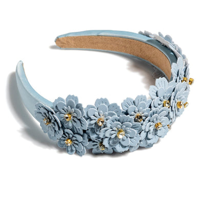 Add an elevated touch to your summer hairstyles with Shiraleah's Flower Embellished Headband. With its intricate floral and rhinestone embellishments, this chic and trendy headband will be your new favorite summer accessory. Pair with other items from Shiraleah to complete your look! 

Features delicate light blue flower embellishments and gold rhinestones
Shiraleah is a trend-driven lifestyle brand focused on the little gifts that make life special!
Made from pu and rhinestones
One size
Made in China

Fulfilled by our friends at Shiraleah 
*Please Note: 

Rewards cannot be applied to this product
This item is not eligible for returns 
This item cannot be shipped outside the U.S.
