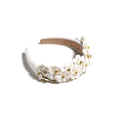 Add an elevated touch to your summer hairstyles with Shiraleah's Flower Embellished Headband. With its intricate floral and rhinestone embellishments, this chic and trendy headband will be your new favorite summer accessory. Pair with other items from Shiraleah to complete your look! 

Features delicate white flower embellishments and gold rhinestones
Shiraleah is a trend-driven lifestyle brand focused on the little gifts that make life special!
Made from pu and rhinestones
One size
Made in China

Fulfilled by our friends at Shiraleah 
*Please Note: 

Rewards cannot be applied to this product
This item is not eligible for returns 
This item cannot be shipped outside the U.S.

