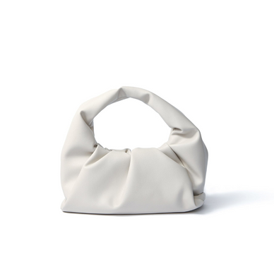 The Marshmallow Croissant handbag is not only a fan favorite but also a buzz-worthy handbag that has caught the media's attention. This very simple yet artistic design is a great evening handbag that will surely make a statement. Catch everyone's attention with this trendy piece! 

Genuine leather

 11" x 9.9" x 3.9" (28cm x 25cm x 10cm)

Foldable magnetic top closure
1 internal compartment 

Imported

Fulfilled by our friends at Bob Oré 
*Please Note: 

Rewards cannot be applied to this product
This item is not eligible for returns 
This item cannot be shipped outside the U.S.
