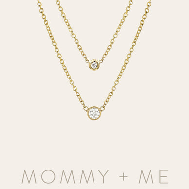   
Match your little one with all the love, with these bezel diamond necklaces. Share the love for jewelry with this timeless set. (Sold as pairs) 
Our pieces are all made with natural, solid gold, meaning they are hypoallergenic and safe for sensitive skin.  
Small Bezel Diamond Necklace: 

Length: 16" - 18" adjustable
Diamond Carat Weight: Approx. 0.10ctw
Size of Bezel: Approx. 3mm

Mini Bezel Diamond Necklace: 

Length: 12" - 14" adjustable
Diamond Carat Weight: Approx. 0.03ctw
Side of Bezel: Approx. 2mm

Ships in 5-10 business days, rush orders ship in 4-6 business days.  Comes gift ready in a beautiful custom Zoe Lev jewelry box. 
Fulfilled by our friends at Zoe Lev Jewelry 

*Please Note: 

This item is not eligible for returns 
This item cannot be shipped outside the U.S.
