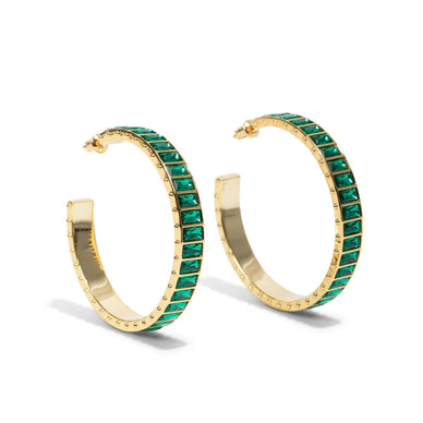 Turn heads this holiday with our Large Eternity Gem Hoop in our Green Stone Color way. Perfect for party season, these epic earrings are made for celebrating. 
*Sold as a pair 
Measurement: 45mm 
Metal + Materials: 14k gold plating over brass, Swarovski gems circle the entire hoop 
Fulfilled by our friends at Short Suite 

*Please Note: 

This item is not eligible for returns 
This item cannot be shipped outside the U.S.
