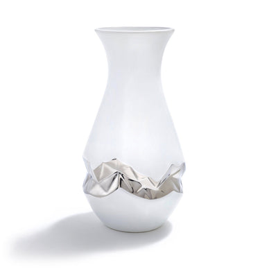 Our Oro vase is designed to celebrate the "beautiful imperfection" in all of us. To manifest the idea of accepting ourselves exactly as we are, our first collection carves proprietary algorithmic patterns into the sides of vases, bending the notion of "perfection". This vase continues our exploration into biomorphic design: the algorithmic pattern we created is a 3D mathematical pattern inspired by principles found in nature. The result is exquisite porcelain objects which are recognizable as vases, hold flowers with grace, and are simultaneously entirely unexpected. Hand-painted with Silver, they are each as unique as we are. 


Ceramic and Silver details 

Imported

Wipe clean with damp soft cloth 

5" x 5" x 12"

Fulfilled by our friends at ANNA NEW YORK 
*Please Note: 

Rewards cannot be applied to this product
This item is not eligible for returns 
This item cannot be shipped outside the U.S.

