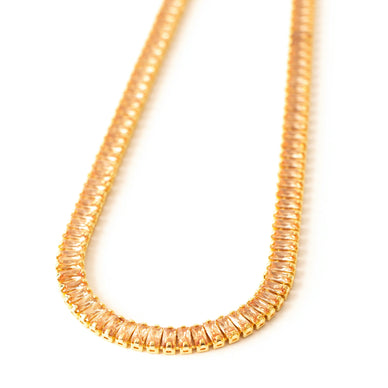 Deck your décolletage out this season with our show-stopping Eternity Gem Tennis Necklace in Honey. Layer with an SS choker for a well-styled stack or let it shine solo.  
Swarovski honey Color gems surround your neck 14k Gold plating over Brass. Both versions are adjustable for a choker or necklace look. 
14" Adjustable + 2" 
16" Adjustable + 2" 
Fulfilled by our friends at Short Suite 

*Please Note: 

This item is not eligible for returns 
This item cannot be shipped outside the U.S.
