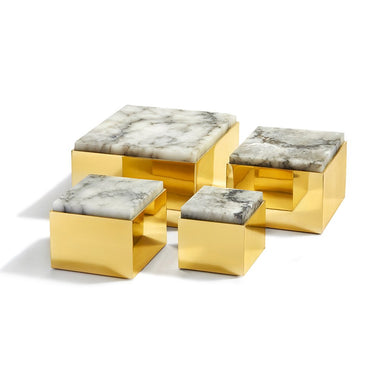 The Alabaster stone used in the crafting of our Scatola box comes from the last remaining quarry of its kind in Italy, and is thought to encourage calmness. This handsome stone is set atop a weighty, solid brass base, creating a quiet statement whether perched atop a table or set on a bookshelf. 

Pure Brass Alabaster
Made in Imported
Each box is unique in color, shape and pattern
Wipe clean with soft, damp cloth as needed.
X Large: 7.5” x 7.5” x 4.5” / 19cm x 19cm x 11cm

  
The crystal of our Alabaster box is thought to prevent tension and to enhance concentration. Some even believe it can heal hurt feelings! Our stone box is thought to provide just the sort of gentle healing that's so helpful at this moment, all while keeping your treasures safe within. 
Fulfilled by our friends at ANNA NEW YORK 
*Please Note: 

Rewards cannot be applied to this product
This item is not eligible for returns 
This item cannot be shipped outside the U.S.
