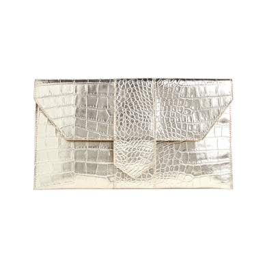 Carry this metallic mock-croc clutch to all your celebrations this season and give any look a glamorous upgrade. 

Color: Platinum Croc
Fabric: Vegan Leather
Dimensions: 6.75 in H X 12.25 in W X 1 in D

*Please Note: 

Rewards cannot be applied to this product

This item is not eligible for returns 

