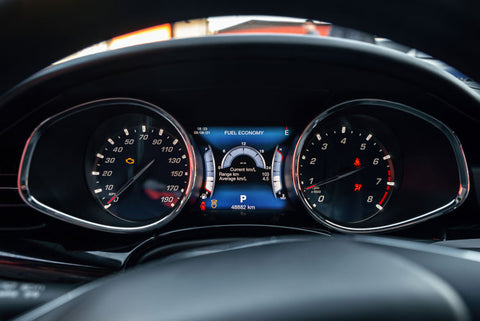 Screen display of a car's check engine light warning on dashboard.