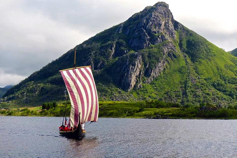 Longship in the fjord at Lofotr Viking Festival