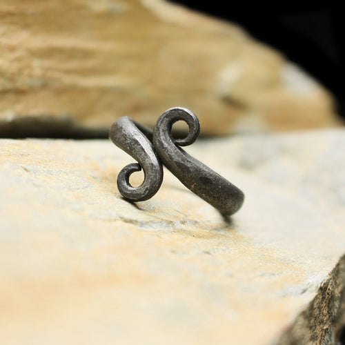 Hand-Forged Iron Viking Ring on Rock