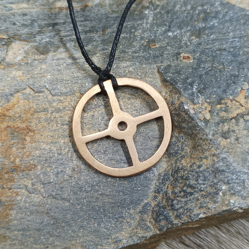 Bronze Sun Cross Odin Pendant on Rock