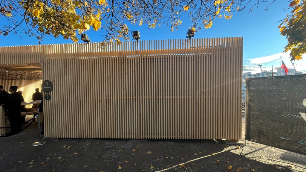 Shipping container cladded with timber battens