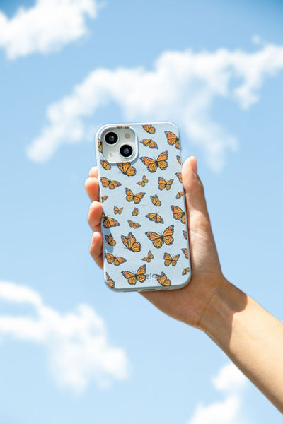 blue iphone case with monarch butterflies on it