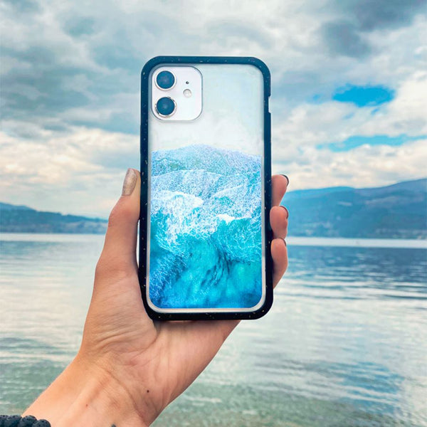 Clear wave phone protective case next to ocean