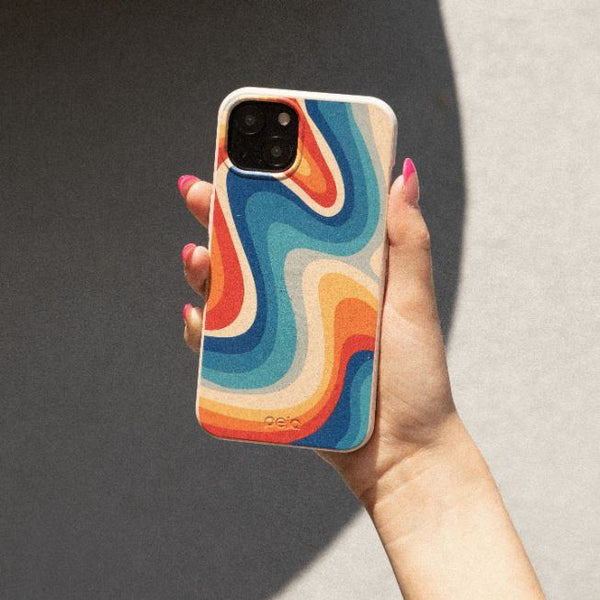 A and holding a colorful disco-inspired phone case