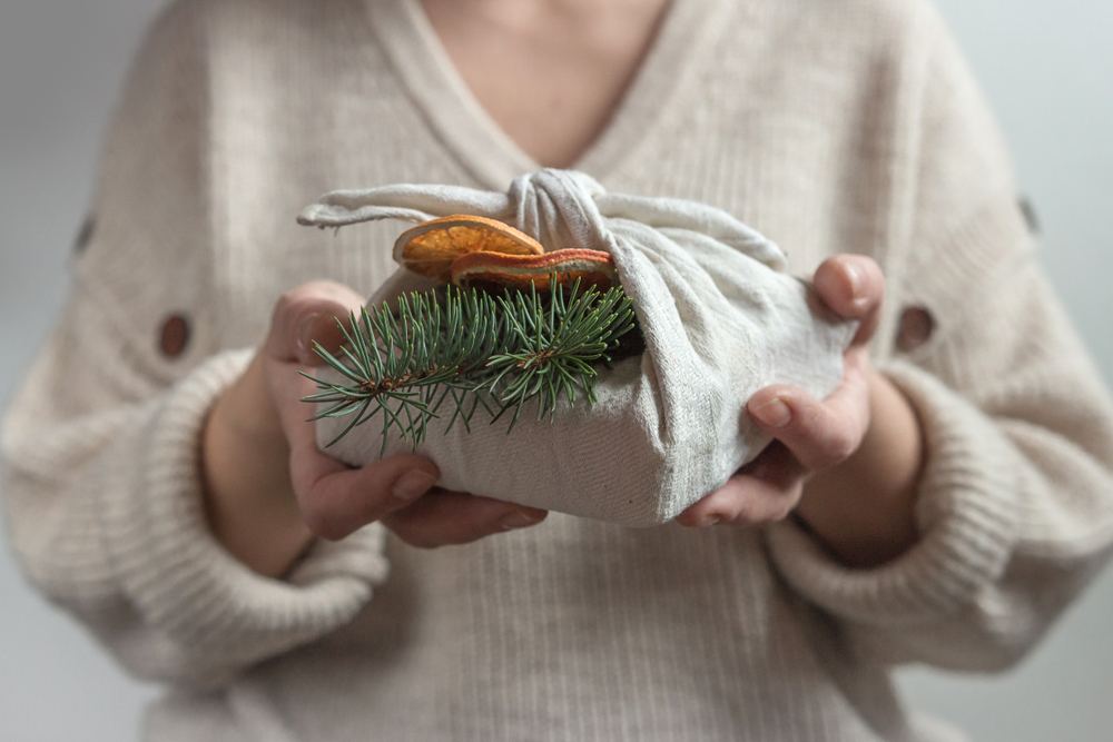A person holding a sustainable gift