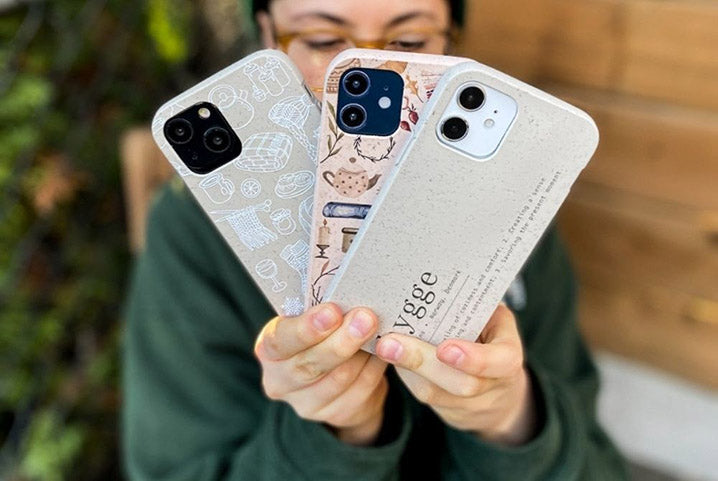 holding various phone cases