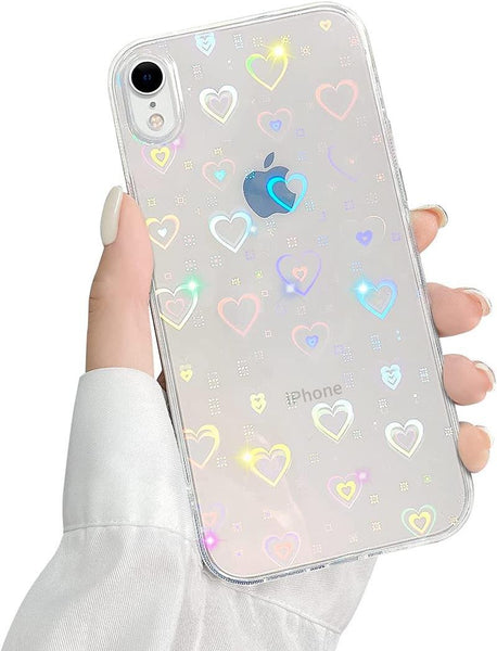 A hand holds a phone with a glittery heart case