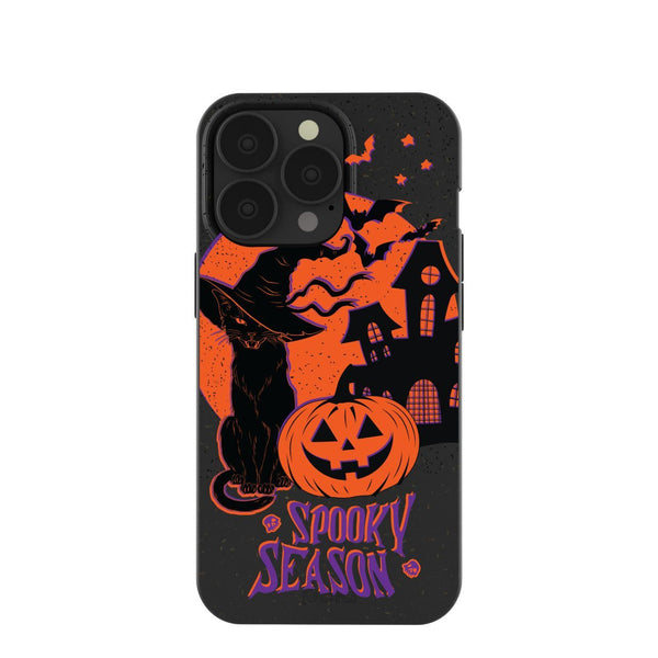 black phone case with black cat, pumpkin, and haunted house
