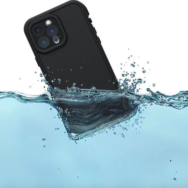 A phone in a black case partially submerged in water