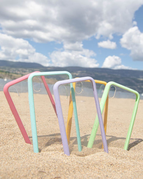 Colorful clear cases on the sand