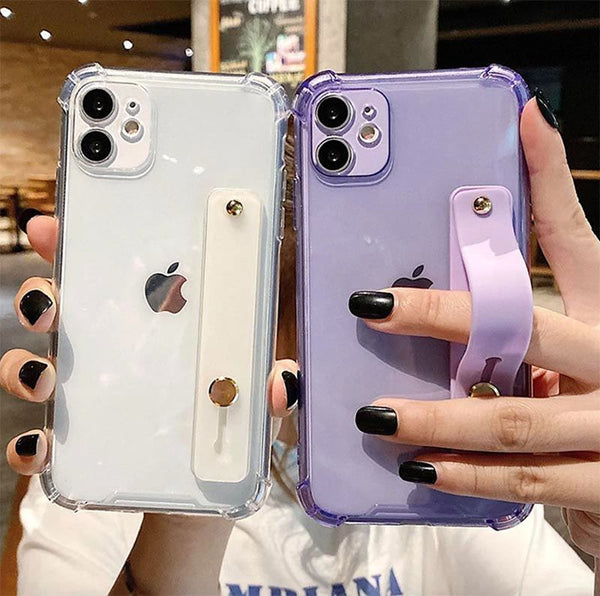 A person holding two phones one in a clear case and the other in a clear purple case
