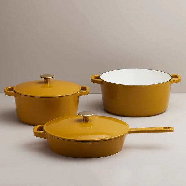 Three dijon yellow cast iron pots