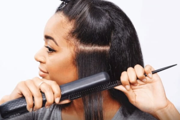 black woman straighten her hair