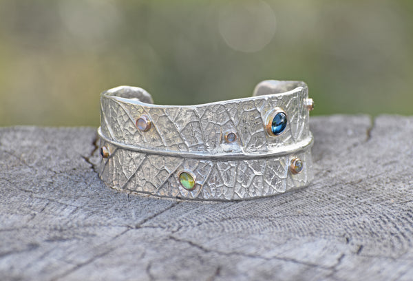 silver-leaf-cuff-bracelet-with-gold-set-gemstones