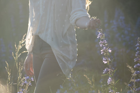 Woman touching flowers