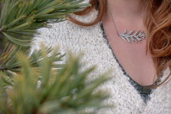 woman-wearing-silver-cedar-tree-necklace