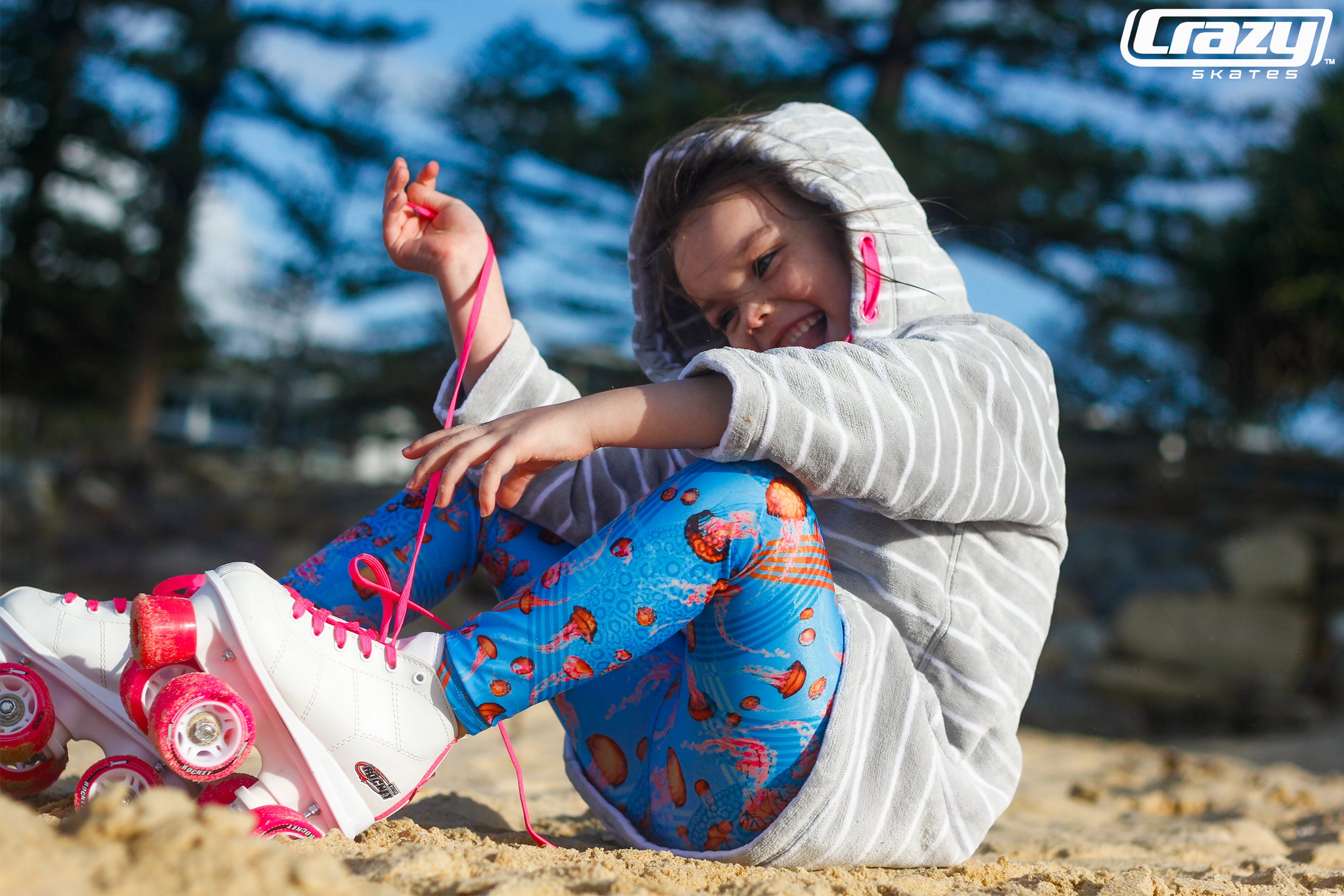 girl on the beach with rocket junior crazy skates