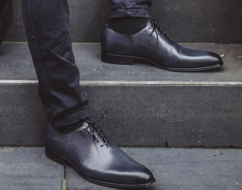 Grey wholecut oxford shoes with grey outfit detail