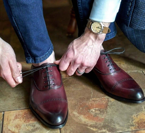 oxblood cap toe oxford shoes blue jeans