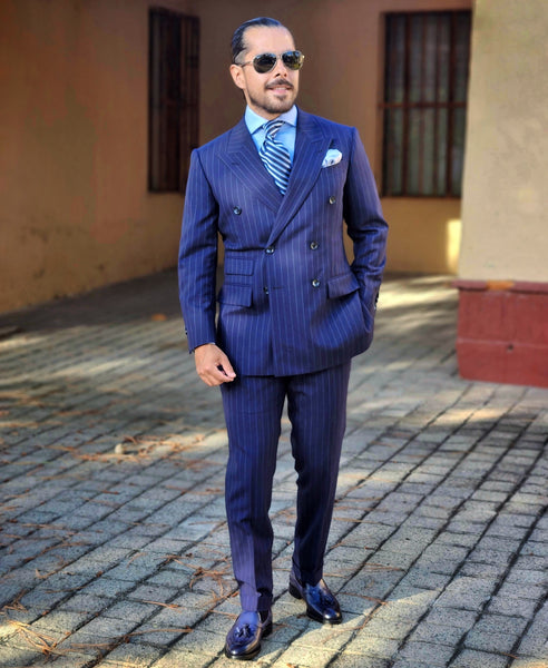 Blue tassel loafers with navy blue suit