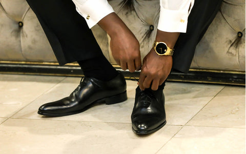 Black wholecut wedding shoes with a tuxedo