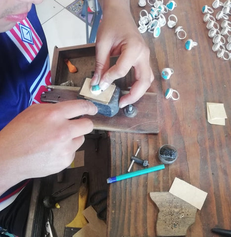 Our Metalsmith in Taxco, Mexico setting a Turquoise nugget into our adjustable Sterling Silver Rings