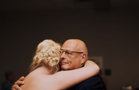 Father hugging daughter