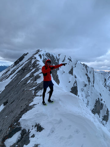 Mikhail Gerylo on a snowy mountain top in VJ Shoes