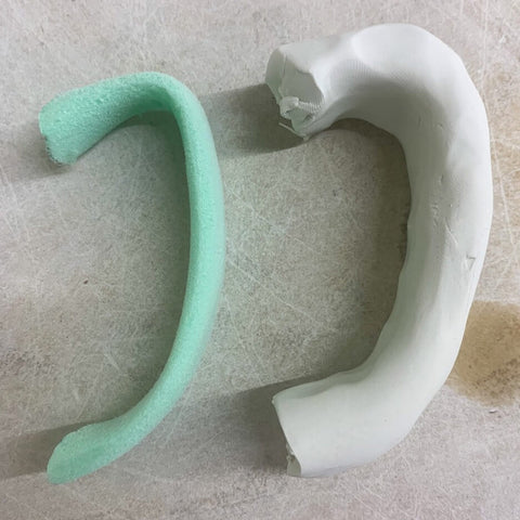 handle carved from foam and a polymer clay thats about to be carved into a handle