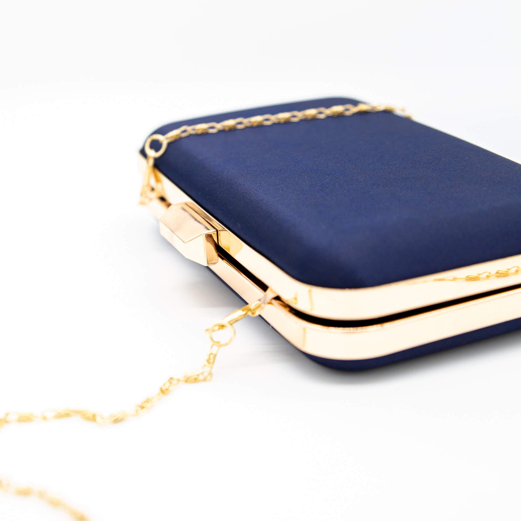 navy blue and gold clutch