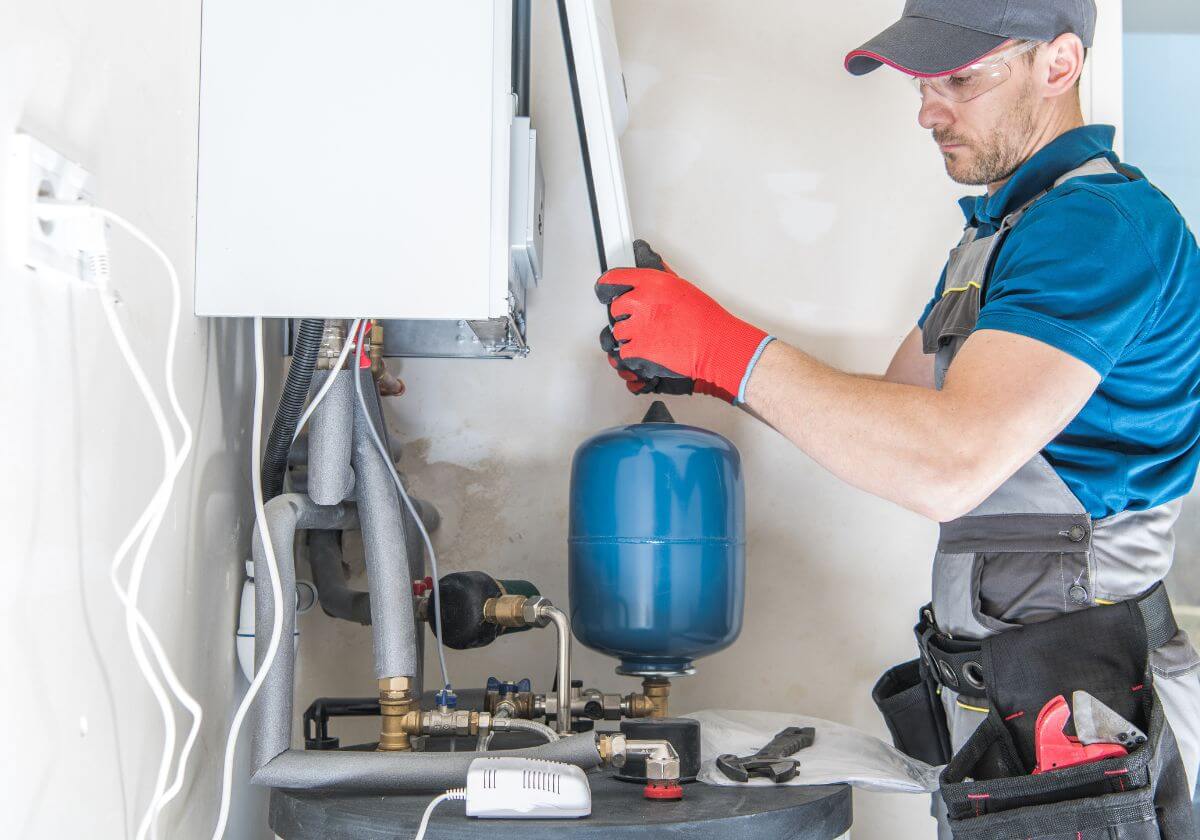 a professional worker installing a water softener